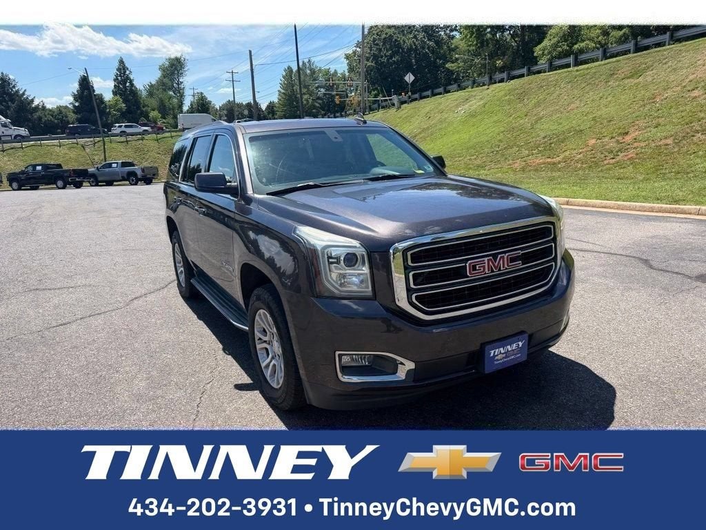 2015 GMC Yukon SLE in Iridium Metallic — front three-quarter view