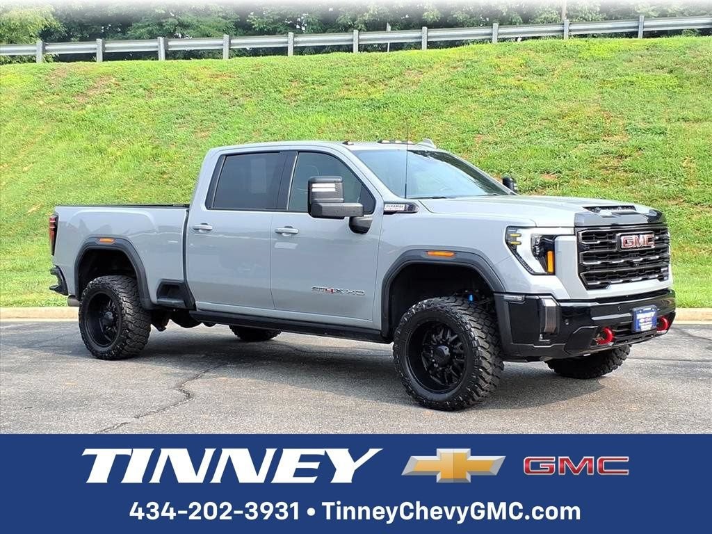 2024 GMC Sierra 2500 HD AT4X in Thunderstorm Gray — front three-quarter view