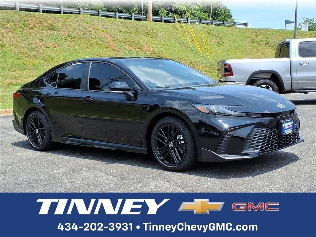 2026 Toyota Camry LE in Black — front three-quarter view